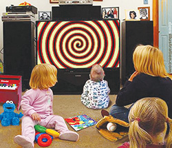 Dees-family-watching-hypnotic-TV-screen